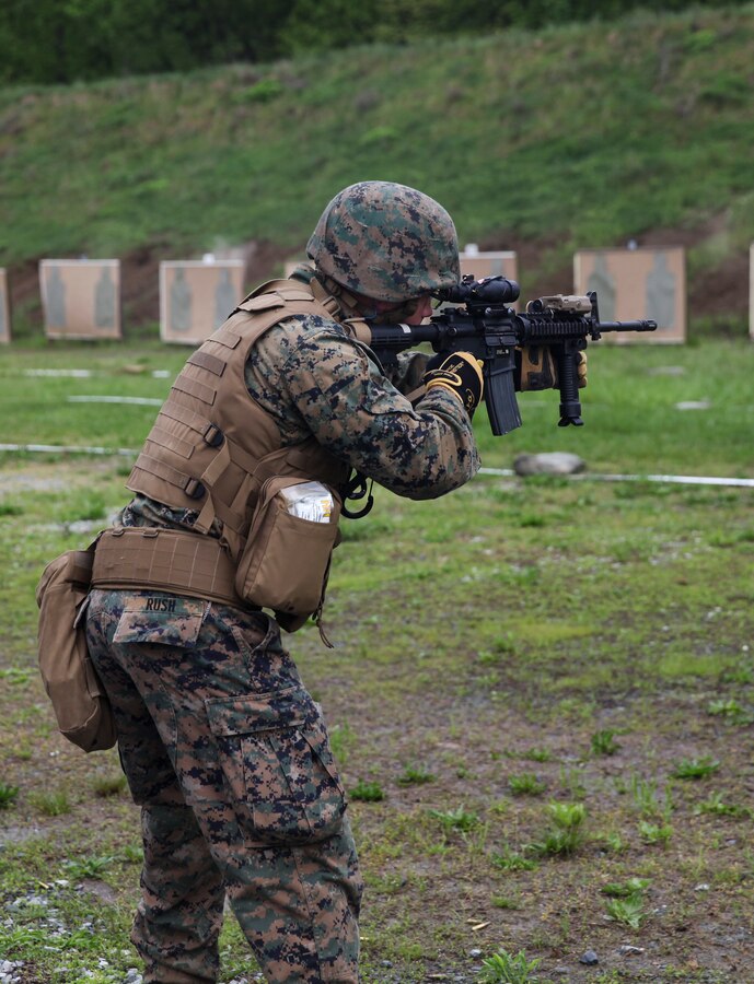 U.S. Marine Sgt. Derek R. Rush, marksmanship coach with Headquarters and Service Company, 6th Engineer Support Battalion, 4th Marine Logistics Group, Marine Forces Reserve, shoots at his target during a live fire range of tables five and six during exercise Red Dagger at Fort Indiantown Gap, Pa., May 14, 2018. Exercise Red Dagger is a bilateral training exercise that gives Marines an opportunity to exchange tactics, techniques and procedures as well as build working relationships with their British counterparts. (U.S. Marine Corps photo by Sgt. Melanie Wolf/Released)