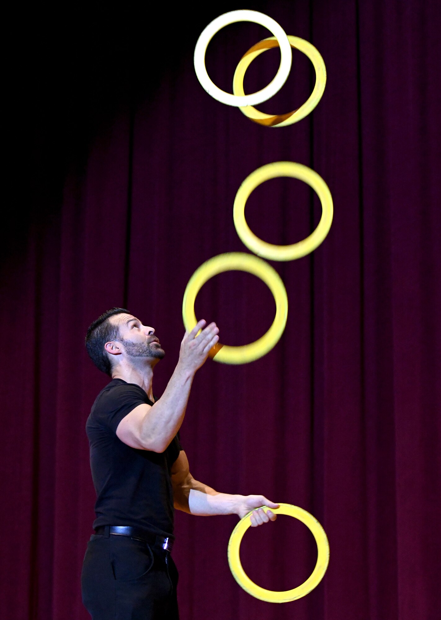 Ivan Pecel, juggler, performs a routine during his show at the Welch Theater at Keesler Air Force Base, Mississippi, May 9, 2018. Pecel, an award winning juggler with more than 15 years of juggling experience, is also a comedian and performed during the first season of America’s Got Talent. (U.S. Air Force photo by Kemberly Groue)