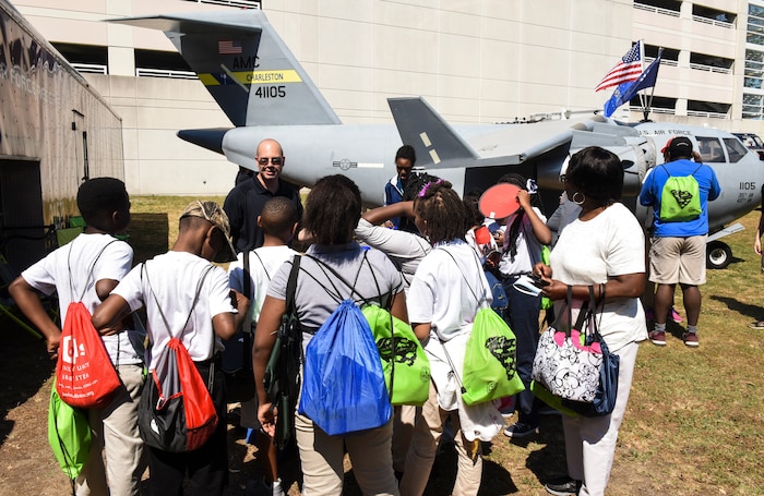 Tech. Sgt. Jared Bryant, U.S.Air Force recruiter, talks to kids about the Air Force during the fourth annual Federal Executive Association Government Expo May 11, 2018, at Liberty Square, Charleston, S.C.