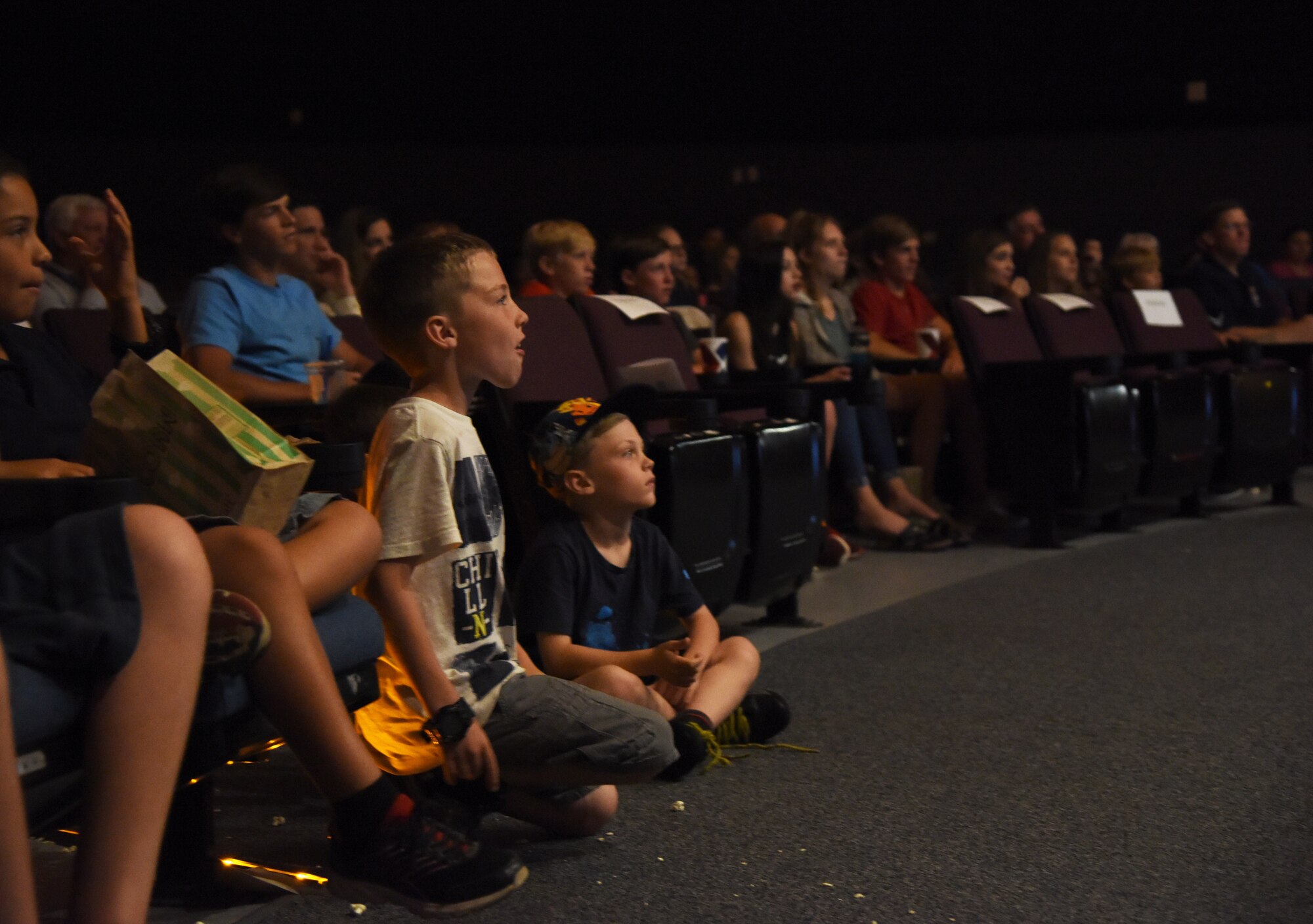 Alex, son of 2nd Lt. Bryan Case, 81st Comptroller Squadron deputy flight commander, attends the Ivan Pecel show at the Welch Theater at Keesler Air Force Base, Mississippi, May 9, 2018. Pecel, an award winning juggler with more than 15 years of juggling experience, is also a comedian and performed during the first season of America’s Got Talent. The 81st Force Support Squadron and The Air Force Services Activity hosted the event. (U.S. Air Force photo by Kemberly Groue)