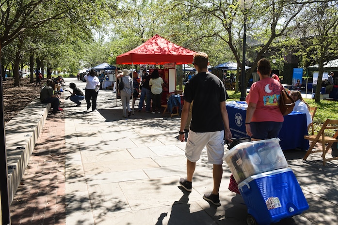Attendees visit different booths during the fourth annual Federal Executive Association Government Expo May 11, 2018, at Liberty Square, Charleston, S.C.