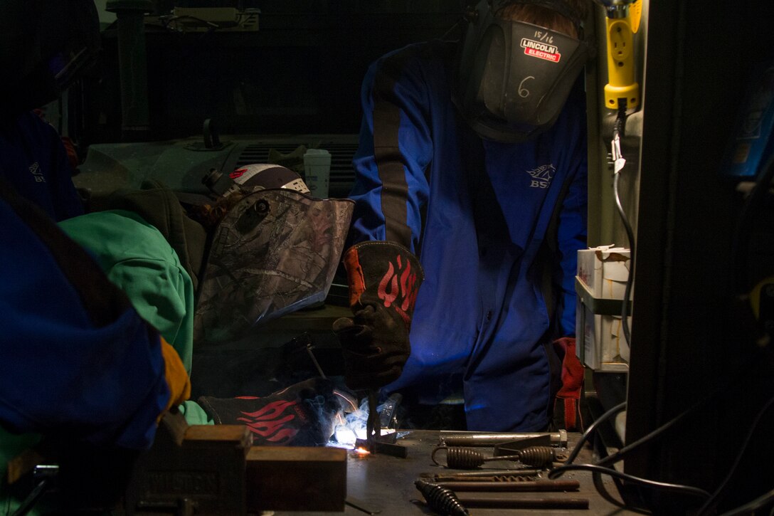 Students compete in a welding competition hosted by VTC and Vermont National Guard.