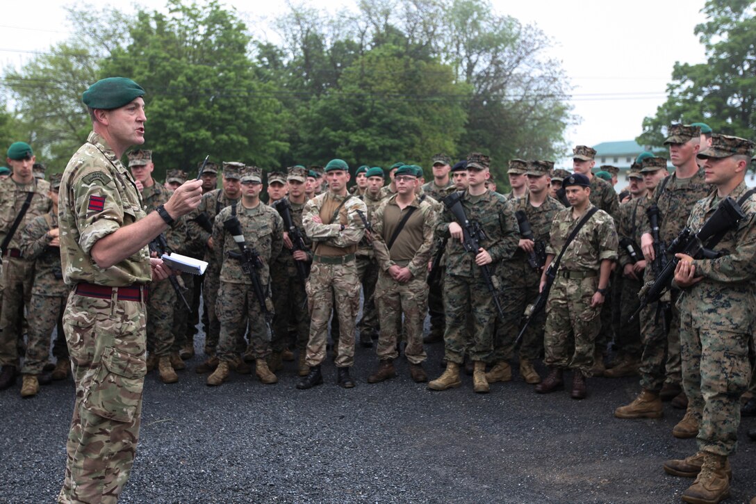 British army Staff Sgt. Nigel W. Oakley, non-commissioned officer in charge of exercise Red Dagger with 131 Commando Squadron Royal Engineers, British army, speaks to the Marines with 6th Engineer Support Battalion, 4th Marine Logistics Group, Marine Forces Reserve, and the British commandos with 131 Commando Squadron RE, British army, at a formation held during exercise Red Dagger at Fort Indiantown Gap, Pa., May 14, 2018.