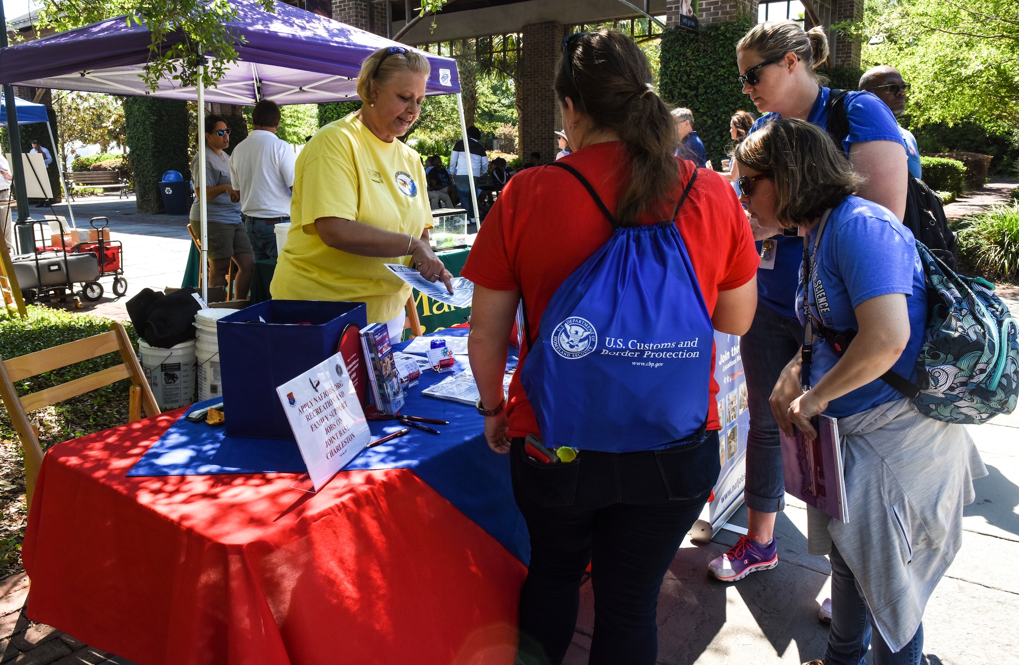 Attendees visit different booths during the fourth annual Federal Executive Association Government Expo May 11, 2018, at Liberty Square, Charleston, S.C.
