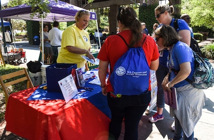 Attendees visit different booths during the fourth annual Federal Executive Association Government Expo May 11, 2018, at Liberty Square, Charleston, S.C.