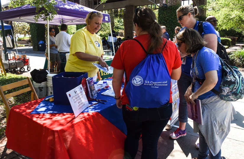 Attendees visit different booths during the fourth annual Federal Executive Association Government Expo May 11, 2018, at Liberty Square, Charleston, S.C.