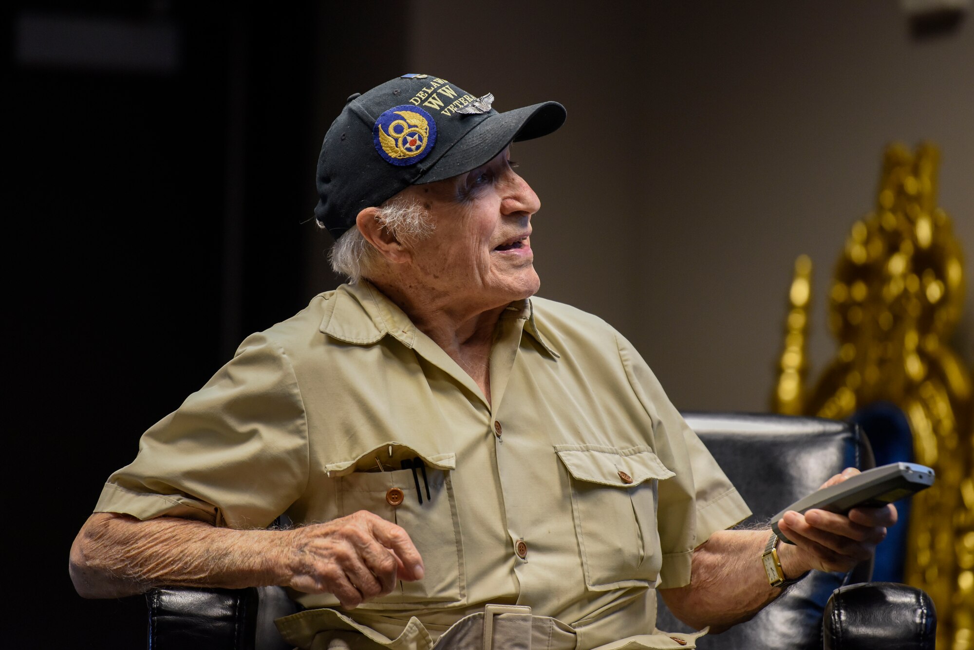 Retired Army Air Corps 1st Lt. Ray Firmani, World War II B-17 pilot, speaks at the quarterly Hangar Talk May 10, 2018, at Dover Air Force Base, Del. Firmani was inducted into the Delaware Aviation Hall of Fame in 2015 for his service in the 486th Heavy Bombardment Group during World War II. (U.S. Air Force photo by Airman 1st Class Zoe M. Wockenfuss)