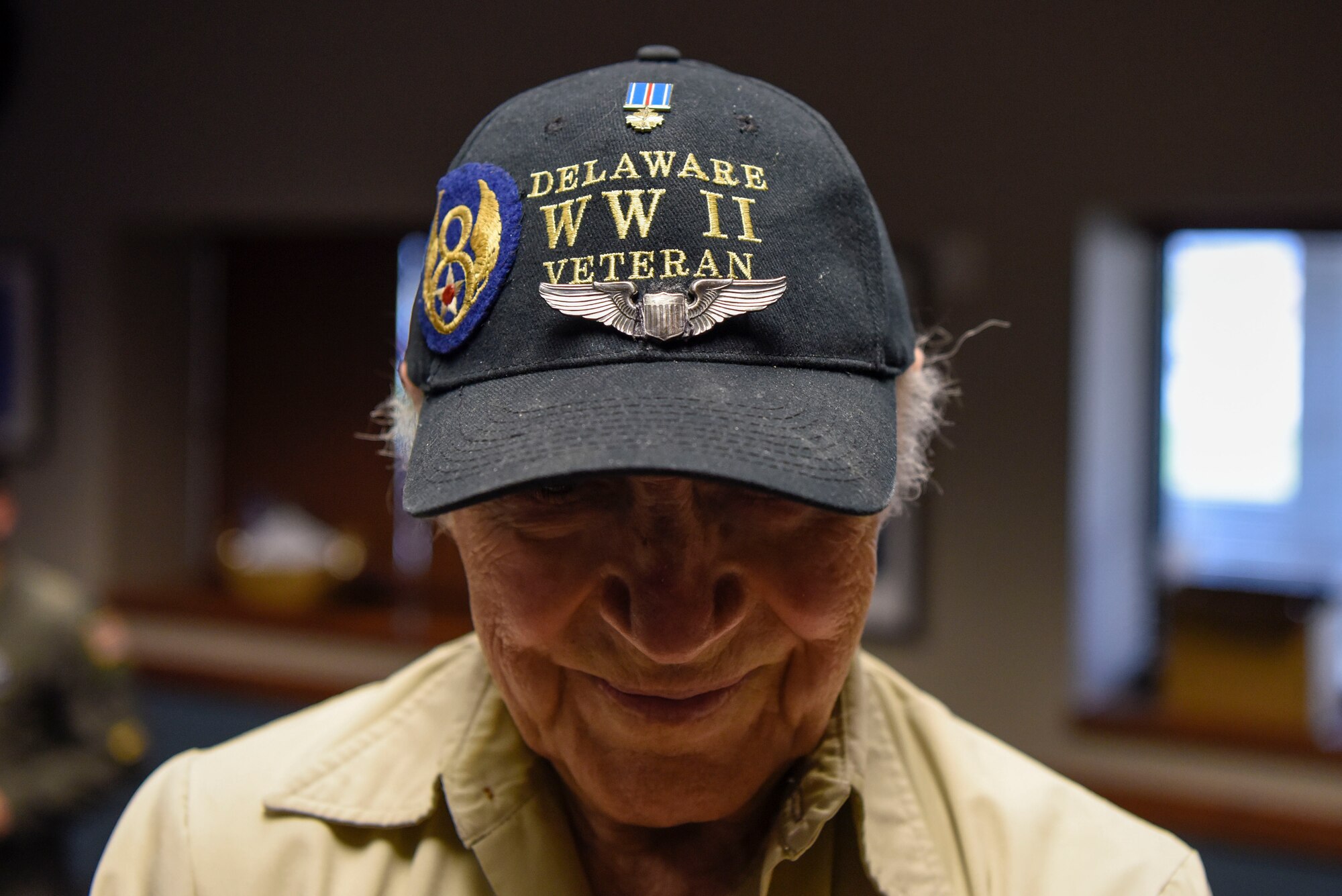 Retired Army Air Corps 1st Lt. Ray Firmani, World War II B-17 pilot, was the guest speaker at the quarterly Hangar Talk May 10, 2018, at Dover Air Force Base, Del. Firmani flew 25 combat missions over Germany, which earned him the Distinguished Flying Cross shown on his hat. (U.S. Air Force photo by Airman 1st Class Zoe M. Wockenfuss)