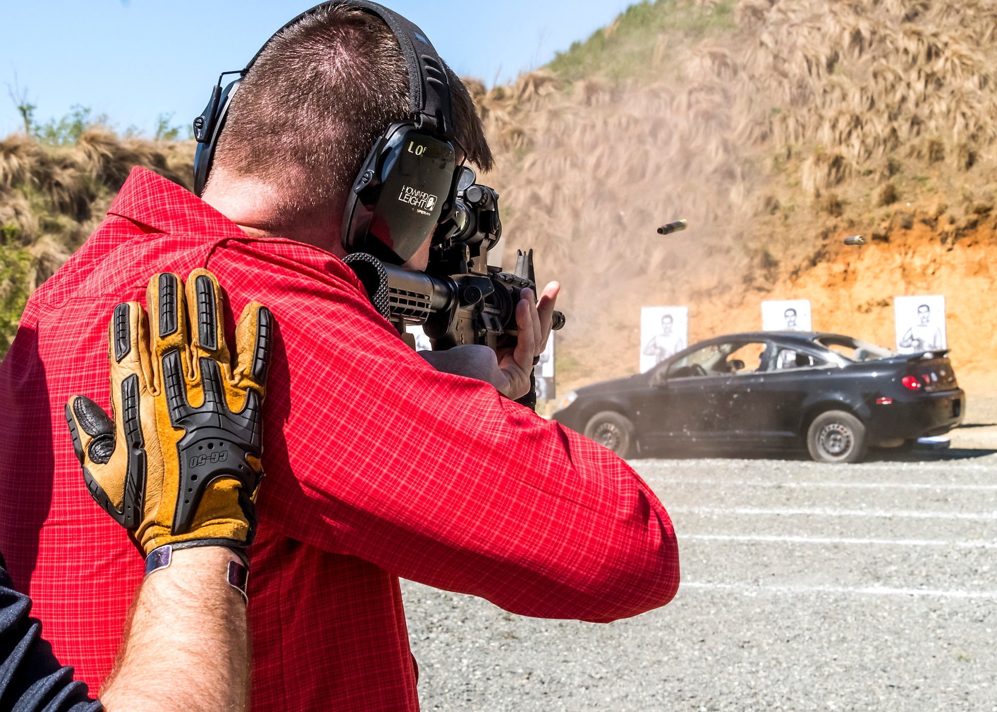 Command Chief Master Sgt. Chad T. Welch, 932nd Airlift Wing, Scott Air Force Base, Ill, fires an M-4 rifle during the weapons familiarization training of the Senior Leader Security Seminar at Montross, Va., April 30, 2018. The unique two-day anti-terrorism course ensures the safety and survivability of Air Force leaders traveling in medium to critical threat areas. (U.S. Air Force photo by Michael Hastings)