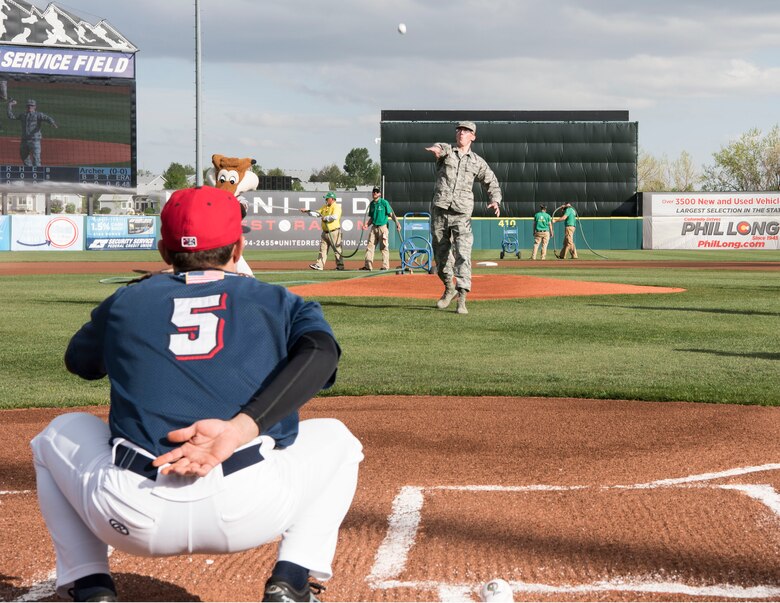 Senior Airman Xavier Brezniak, staff evaluator with the 50th Operations Group, throws the first pitch at the Colorado Springs Sky Sox game versus the Oklahoma City Dodgers at Security Service Field, Colorado Springs, Colorado, May 12, 2018. The Sky Sox hosted a U.S. Air Force appreciation night where they honored Airmen and their family members. 50th Space Wing leadership selected Brezniak to throw the first pitch due to his recent acceptance into the United States Air Force Academy class of 2022. (U.S. Air Force photo by Staff Sgt. Matthew Coleman-Foster)