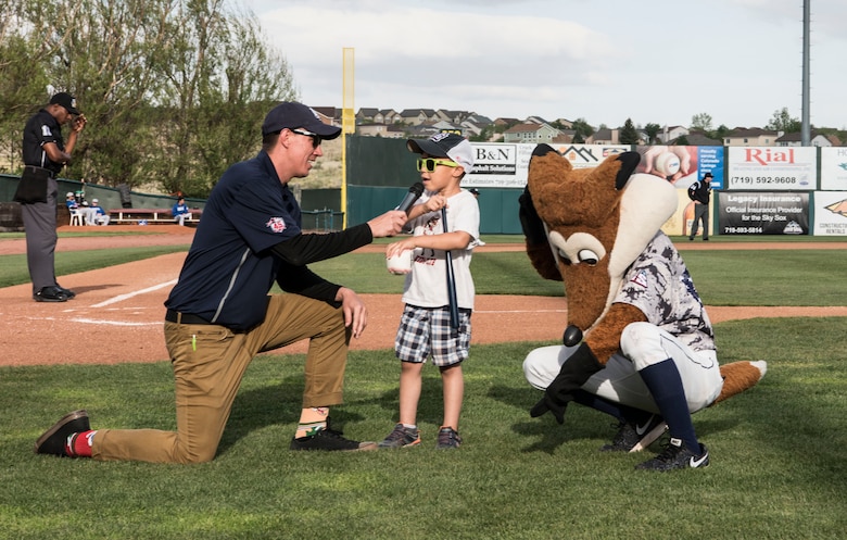 Senior Airman Xavier Brezniak, staff evaluator with the 50th Operations Group, throws the first pitch at the Colorado Springs Sky Sox game versus the Oklahoma City Dodgers at Security Service Field, Colorado Springs, Colorado, May 12, 2018. The Sky Sox hosted a U.S. Air Force appreciation night where they honored Airmen and their family members. 50th Space Wing leadership selected Brezniak to throw the first pitch due to his recent acceptance into the United States Air Force Academy class of 2022. (U.S. Air Force photo by Staff Sgt. Matthew Coleman-Foster)