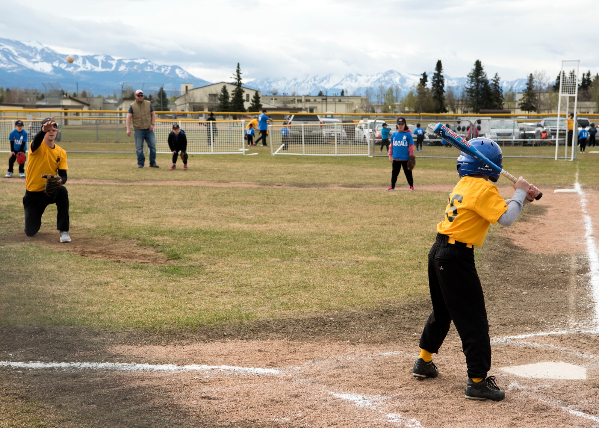 Jack, 8, son of Amber Jeppson, an Army spouse, swings the bat during a coach-pitch Little League opening day game at Joint Base Elmendorf-Richardson, Alaska, May 12, 2018. The games started immediately following the opening day ceremony and continued throughout the day. JBER YSP abides by the National Alliance for Youth Sports-affiliated National Youth Sports Coaches Association, which provides education on topics such as the psychology of coaching youth sports, communication, child abuse, injury prevention, and nutrition and hydration, as well as skills and drills.