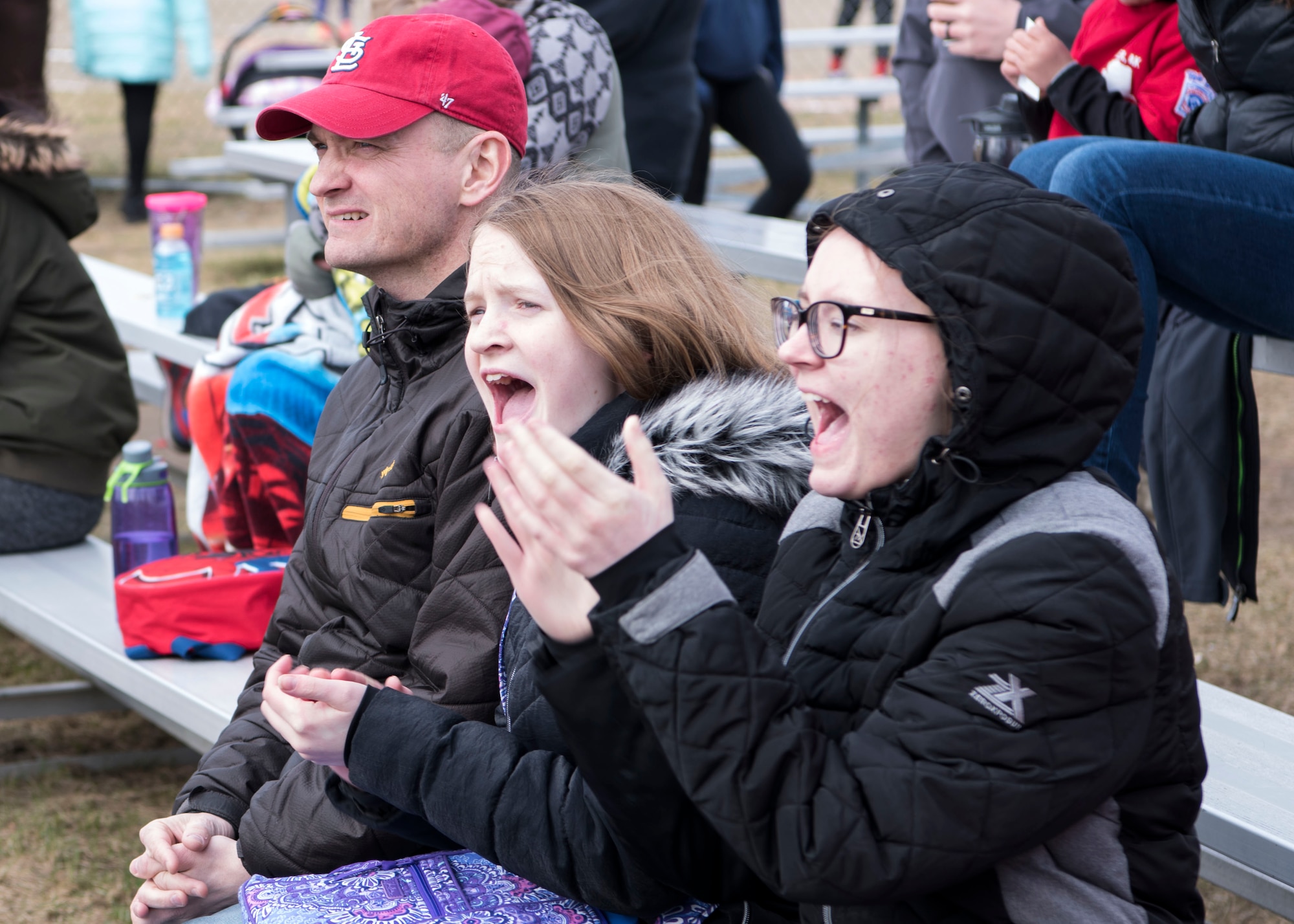 Members of the Jeppson family cheer on players during a Little League opening day game at Joint Base Elmendorf-Richardson, Alaska, May 12, 2018. The games started immediately following the 2018 season opening day ceremony and continued throughout the day. The Fort Richardson Little League started in 1951 and has a continued deep-rooted history at JBER.