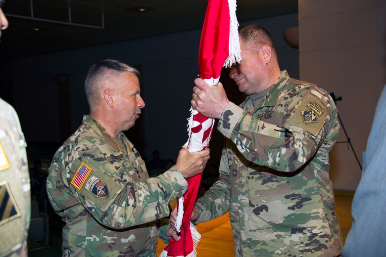 Lt. Gen Todd T. Semonite entrusts the Northwestern Division's unit "colors" to Col. Torrey A. DiCiro during a  Relinquishment of Command ceremony in Portland, Ore.  DiCiro will command the Division of 5,000 employees until the next commanding general arrives in July.