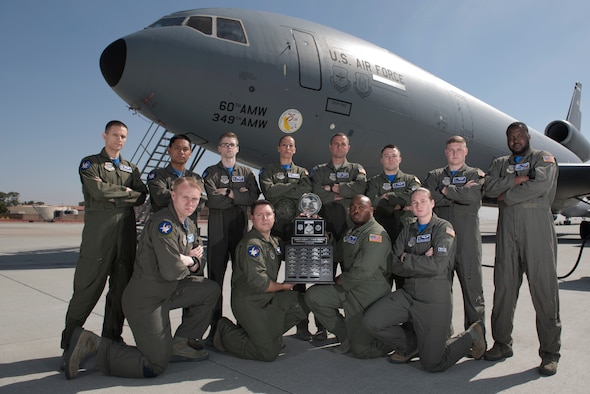 Twelve members of the 6th Air Refueling Squadron pose for a photo with the Senior Master Sgt. Albert Evans Trophy at Travis Air Force Base, Calif., May 11, 2018. The 6th ARS In-Flight Refueling Section was presented the award during the 39th Annual Boom Operator’s Symposium, which was held at Altus AFB, Okla., from April 27 – 29. The award is given annually to the most outstanding air refueling section in the Air Force. The 6th ARS has been awarded the honor six times, more than any other Air Force unit. (U.S. Air Force photo by Tech. Sgt. James Hodgman)