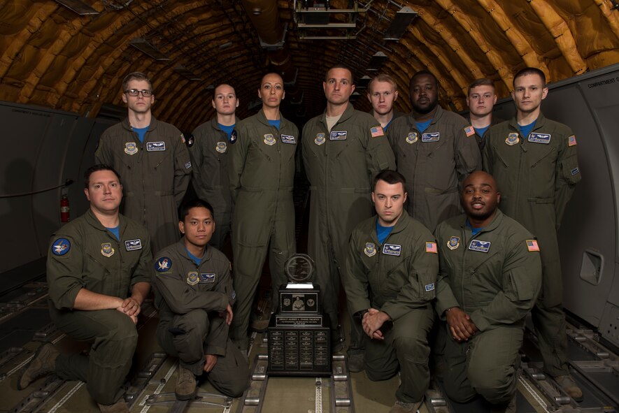 Twelve members of the 6th Air Refueling Squadron pose for a photo with the Senior Master Sgt. Albert Evans Trophy at Travis Air Force Base, Calif., May 11, 2018. The 6th ARS In-Flight Refueling Section was presented the award during the 39th Annual Boom Operator’s Symposium, which was held at Altus AFB, Okla., from April 27 – 29. The award is given annually to the most outstanding air refueling section in the Air Force. The 6th ARS has been awarded the honor six times, more than any other Air Force unit. (U.S. Air Force photo by Tech. Sgt. James Hodgman)