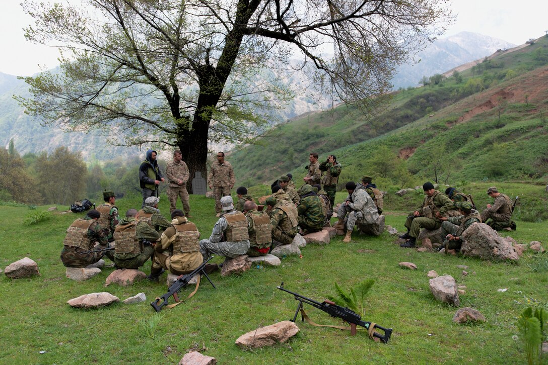 Tajik and U.S. soldiers conduct an after-action review at a mountain training camp outside of Dushanbe, Tajikistan, April 20, 2018, after a simulated patrol through the mountains, an exercise conducted during an exchange of tactics and best practices between the two countries. This information exchange was part of a larger military-to-military engagement taking place with the Tajikistan Peacekeeping Battalion of the Mobile Forces and the 648th Military Engagement Team, Georgia Army National Guard, involving border security tactics and techniques.