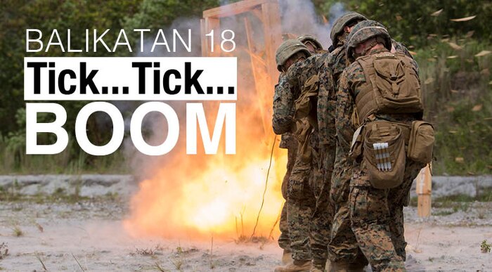 U.S. Marines protect each other against an urban demolition explosion during Exercise Balikatan at Colonel Ernesto Rabina Air Base, Philippines, May 7, 2018. U.S. Marines with Combat Logistics Battalion 4; 2nd Combat Engineer Battalion, 2nd Battalion, 8th Marine Regiment; and 9th Engineer Support Battalion trained together on urban breaching demolition where they learned how to breach buildings with explosives in a combat setting. Exercise Balikatan, in its 34th iteration, is an annual U.S.-Philippine military training exercise focused on a variety of missions, including humanitarian assistance and disaster relief, counterterrorism and other combined military operations held from May 7 to 18. (U.S. Marine Corps photo by Lance Cpl. Isabella Ortega)
