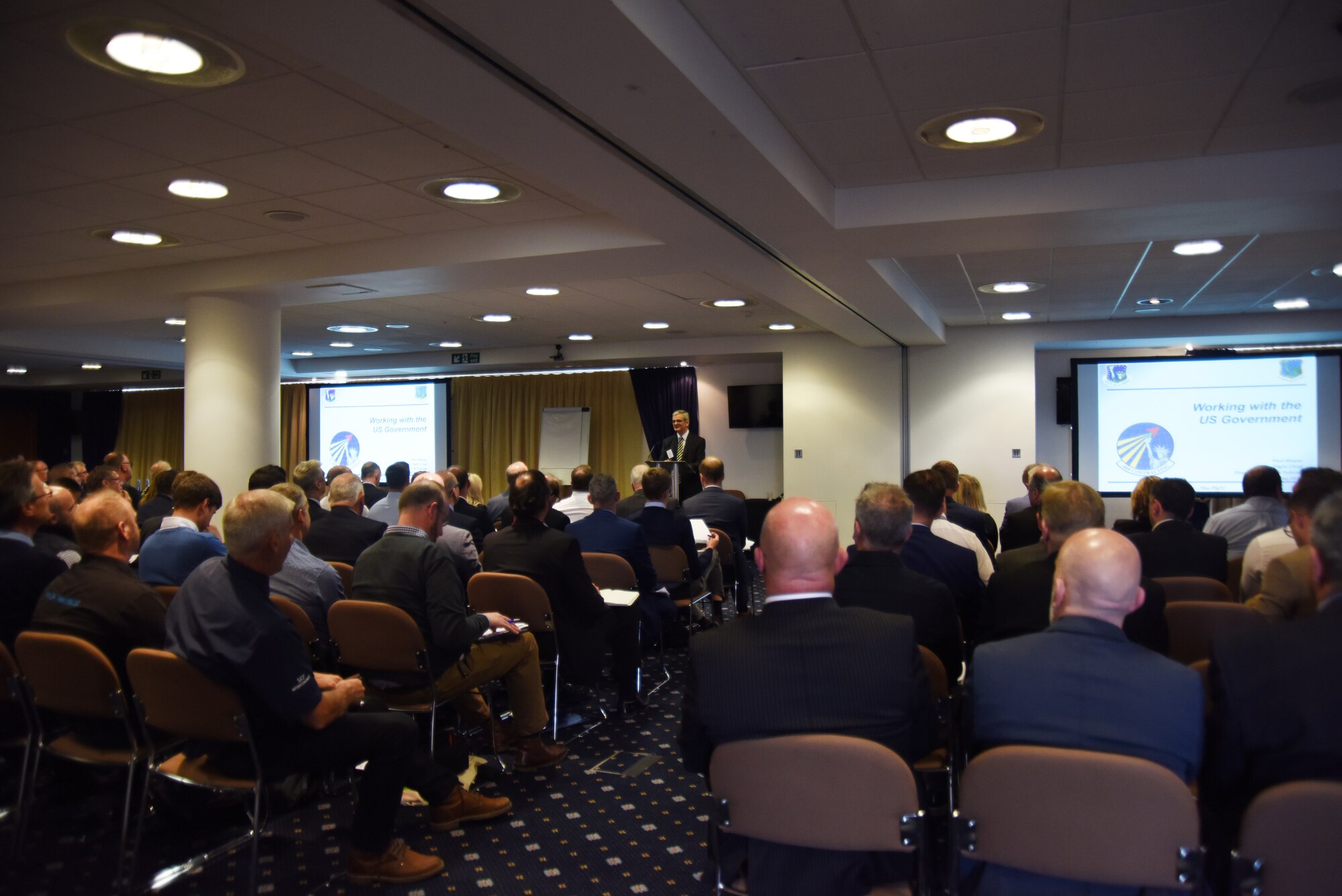 Paul Mayes, 48th Contracting Squadron plans, programs and policy flight chief, speaks to potential contractors during an industry engagement day at Rowley Mile Racecourse conference center, Newmarket, England, May 10. Approximately 150 potential contractors from the local area attended the event and learned about how to find and apply for U.S. Air Force contracts. (U.S. Air Force photo/Senior Airman Abby L. Finkel)