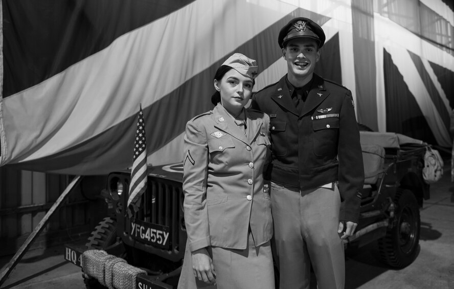 A couple attends a hangar dance at RAF Molesworth, England on May 12, 2018. Approximately 400 American and British guests attended the 501 Combat Support Wing event which showcased singing, dancing, vehicles, dress attire and an aircraft from the time period. (USAF photo by TSgt Brian Kimball)