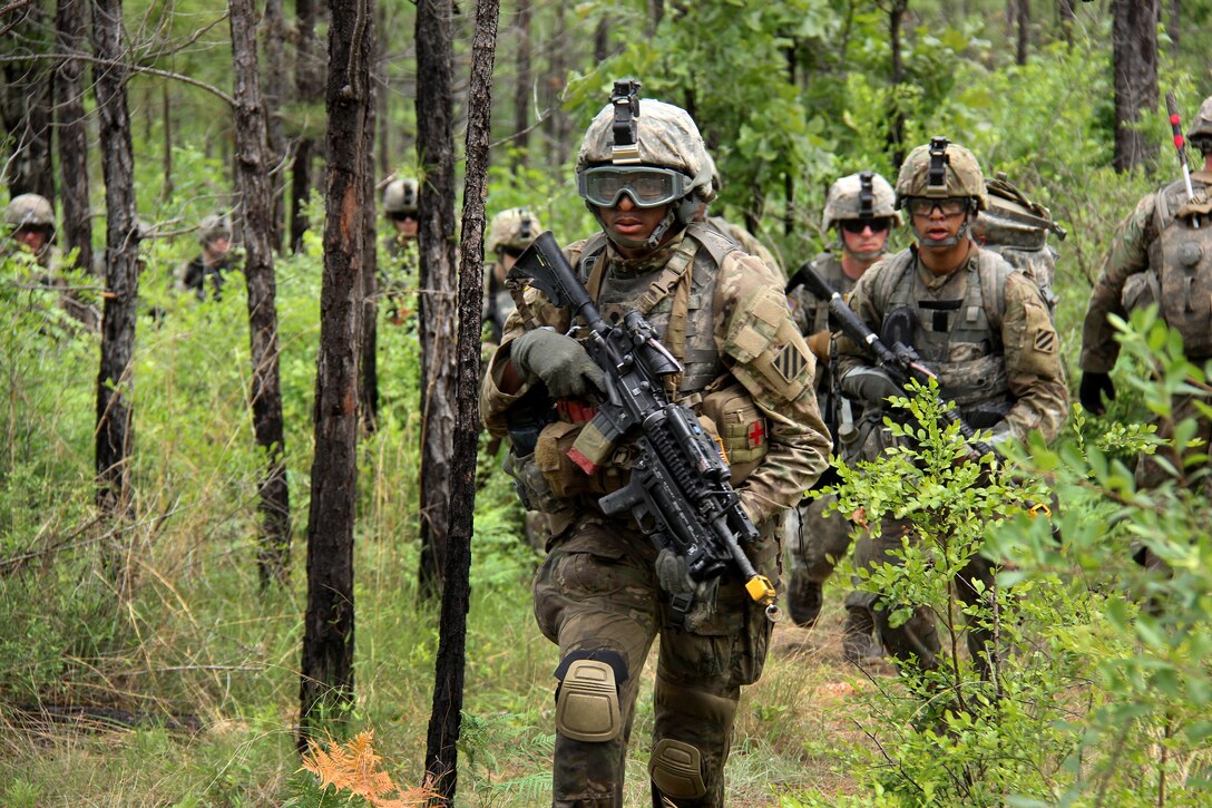 Soldiers maneuver to their follow-on objective.