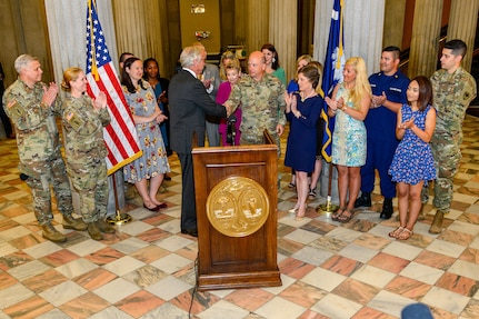 South Carolina Gov. Henry McMaster presents a proclamation recognizing May as Military Spouse Appreciation month throughout South Carolina, joined by U.S. Army Maj. Gen. Robert E. Livingston, Jr. the adjutant general for South Carolina and his wife Barbara, Fort Jackson's Military Family of the Year, Staff Sgt. John Berta and his wife Agata, U.S. Coast Guard Petty Officer Jerry Stevens and his wife Sarah, and other military members with the spouses from the South Carolina Army and Air National Guard.