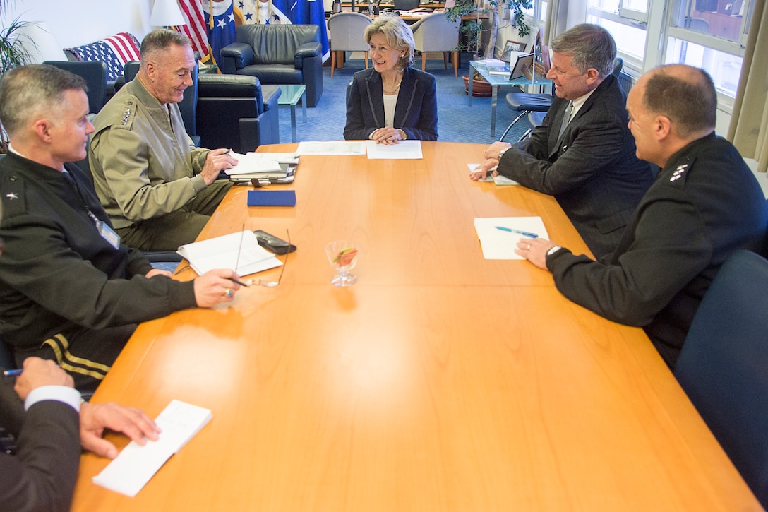 Marine Corps Gen. Joe Dunford, chairman of the Joint Chiefs of Staff, meets with Ambassador Kay Bailey Hutchinson in Brussels.