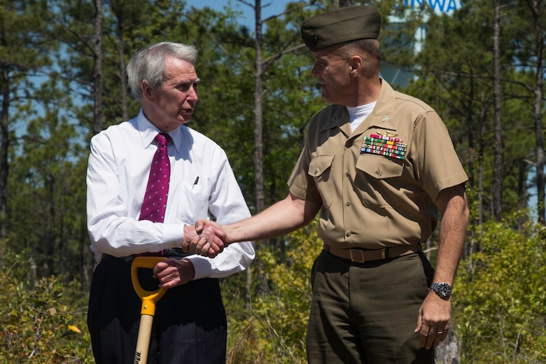 Col. Michael Scalise, Deputy Commander of Marine Corps Installations East, Camp Lejeune shakes hands with Walter Jones, a congressman with the House of Representatives after planting Longleaf Pine Seedlings at the Stones Creek Game Land on Sneads Ferry, North Carolina, April 30. (U.S. Marine Corps photo by Cpl. Breanna L. Weisenberger)