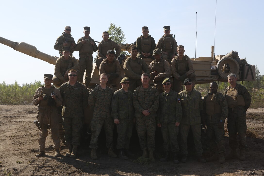 Colonel John J. Carroll, the deputy commander of Marine Forces Europe and Africa, and Maj. Christopher Timms, the Nordic future plans officer, visited the U.S. Marines participating in Exercise Arrow 18 as part of a distinguished visitor tour in Pohjankangas Training Area, Finland, May 15, 2018. The Marines conducted live fire drills with tanks with Finnish counterparts. Marine Corps participation in exercises with partners supports NATO and USEUCOM operational plans, increases interoperability with partners, and enables maintenance of fire and maneuver proficiency for participating forces. (U.S. Marines Corps photo by Sgt. Averi Coppa/Released)