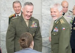 Marine Corps Gen. Joe Dunford, chairman of the Joint Chiefs of Staff, left, arrives to attend the 179th Military Committee in Chiefs of Defense meeting at NATO’s new headquarters building in Brussels, May 16, 2018. Standing next to Dunford is Czech Gen. Petr Pavel, the chairman of NATO’s Military Committee.