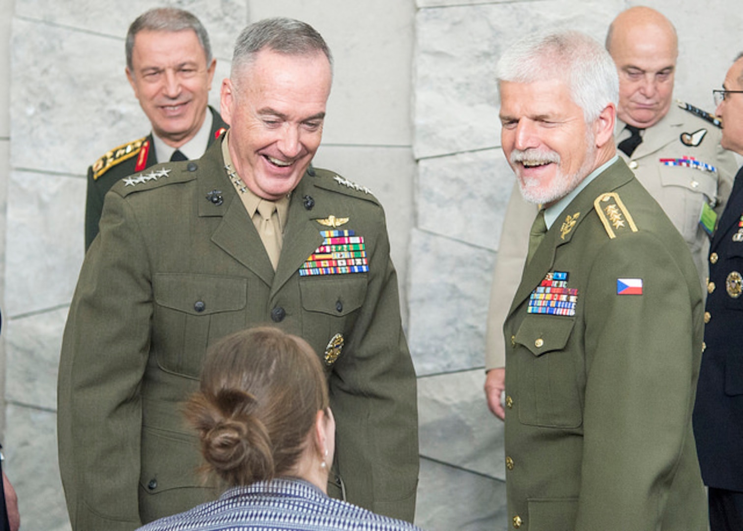 Marine Corps Gen. Joe Dunford, chairman of the Joint Chiefs of Staff, left, arrives to attend the 179th Military Committee in Chiefs of Defense meeting at NATO’s new headquarters building in Brussels, May 16, 2018. Standing next to Dunford is Czech Gen. Petr Pavel, the chairman of NATO’s Military Committee.
