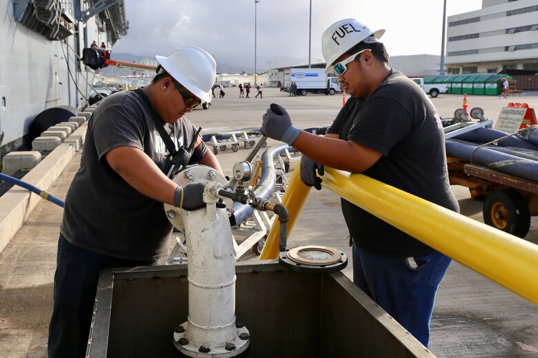 Workers perform maintenance on a fuel system at Naval Station Pearl Harbor, Hawaii. The U.S. Army Engineering and Support Center, Huntsville’s Fuels Program will be the Center’s first program to use General Services Administration schedule recurring maintenance and minor repair service contracts for more than 400 Army, Navy and the Air Force fuel facilities sites around the world.