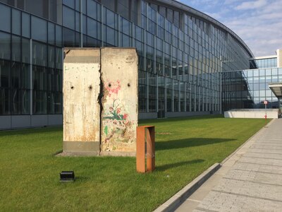 A remnant of the Berlin Wall flanks the entrance to the new NATO headquarters building in Brussels.