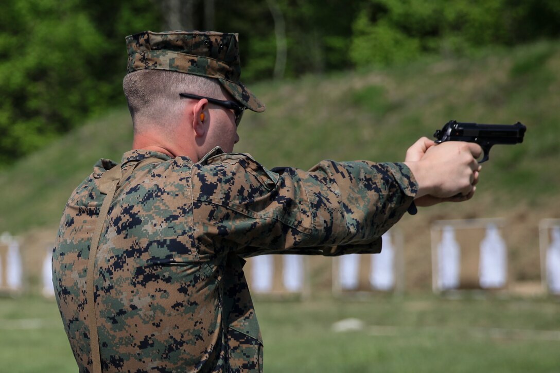 U.S. Marine Lance Cpl. Mitchell R. Neimann, heavy equipment operator with Engineer Company C, 6th Engineer Support Battalion, 4th Marine Logistics Group, fires his weapon at the pistol range during exercise Red Dagger at Fort Indiantown Gap, Pa., May 15, 2018.