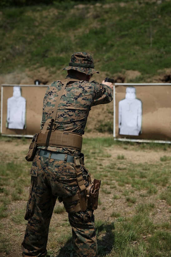 U.S. Marine Lance Cpl. Blake A. Schult, motor vehicle mechanic with Engineer Company C, 6th Engineer Support Battalion, 4th Marine Logistics Group, fires his weapon at the pistol range during exercise Red Dagger at Fort Indiantown Gap, Pa., May 15, 2018.