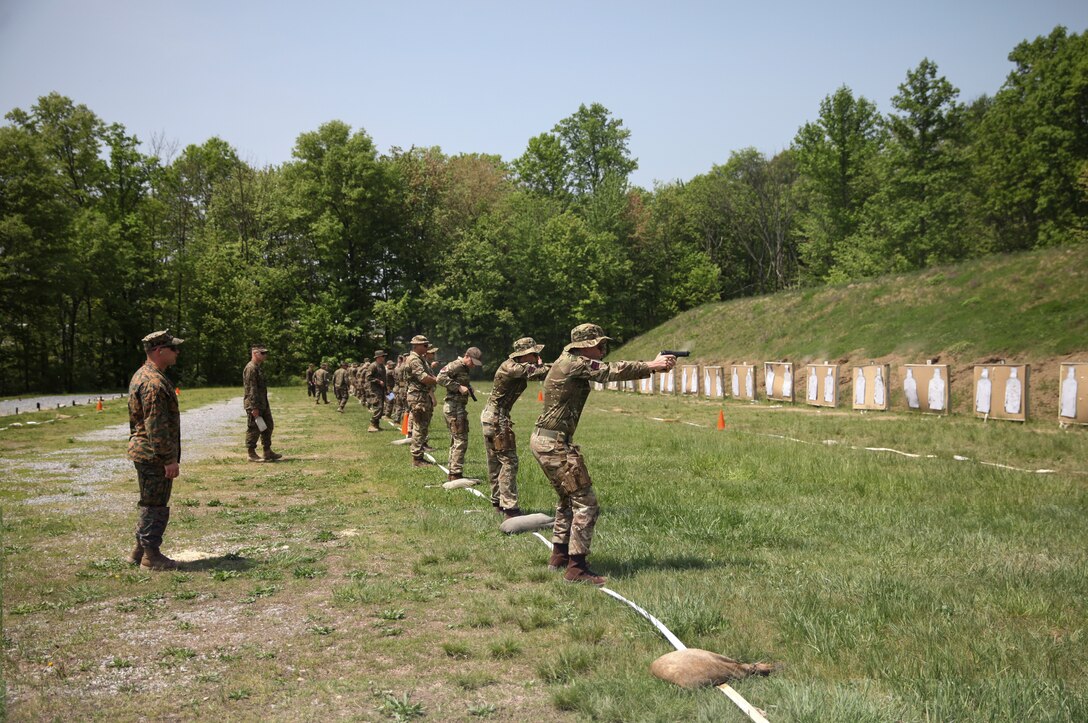 U.S. Marines with 6th Engineer Support Battalion, 4th Marine Logistics Group, and British commando’s with 131 Commando Squadron Royal Engineers, British Army, conduct a live fire pistol range during exercise Red Dagger at Fort Indiantown Gap, Pa., May 15, 2018.