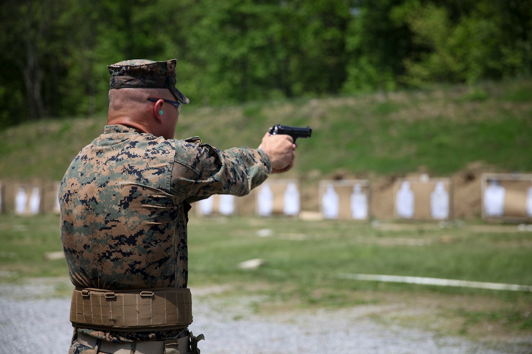 U.S. Marine Cpl. Evan A. Olson, motor vehicle mechanic with Engineer Company C, 6th Engineer Support Battalion, 4th Marine Logistics Group, fires his weapon at the pistol range during exercise Red Dagger at Fort Indiantown Gap, Pa., May 15, 2018.