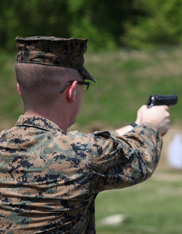 U.S. Marine Lance Cpl. Ryan W. Carlson, field radio operator with Headquarters and Service Company, 6th Engineer Support Battalion, 4th Marine Logistics Group, fires his weapon at the pistol range during exercise Red Dagger at Fort Indiantown Gap, Pa., May 15, 2018.