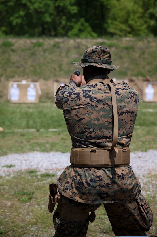 U.S. Marine Lance Cpl. Dontarius J. Allen, combat engineer with Engineer Company C, 6th Engineer Support Battalion, 4th Marine Logistics Group, aims his weapon towards the target at the pistol range during exercise Red Dagger at Fort Indiantown Gap, Pa., May 15, 2018.