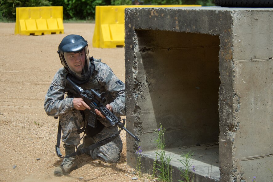 An Airman from the 4th Civil Engineer Squadron prepares to fire on simulated targets during a shoot house competition during Police Week, May 15, 2018, at Seymour Johnson Air Force Base, North Carolina.