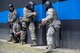 An Airman from the 4th Civil Engineer Squadron prepares to ram a door while his teammates watch his back during a shoot house competition, May 15, 2018, at Seymour Johnson Air Force Base, North Carolina.
