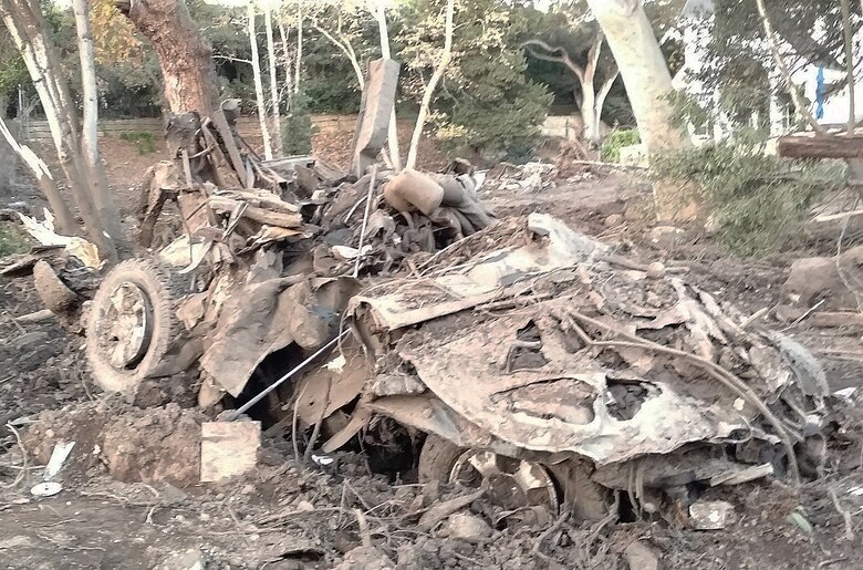 A vehicle sits mangled and destroyed in a yard following a Jan. 9 mudslide in Montecito, California.