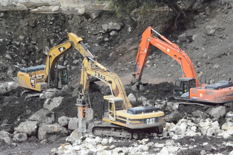 Contractors hired by the U.S. Army Corps of Engineers operate three bulldozers simultaneously to break up and remove large boulders out of the Santa Monica Basin Feb. 27 in Montecito, California. The basin was one of the largest and difficult ones to clear due to the magnitude of water, mud, debris and boulders that initially filled the basin.