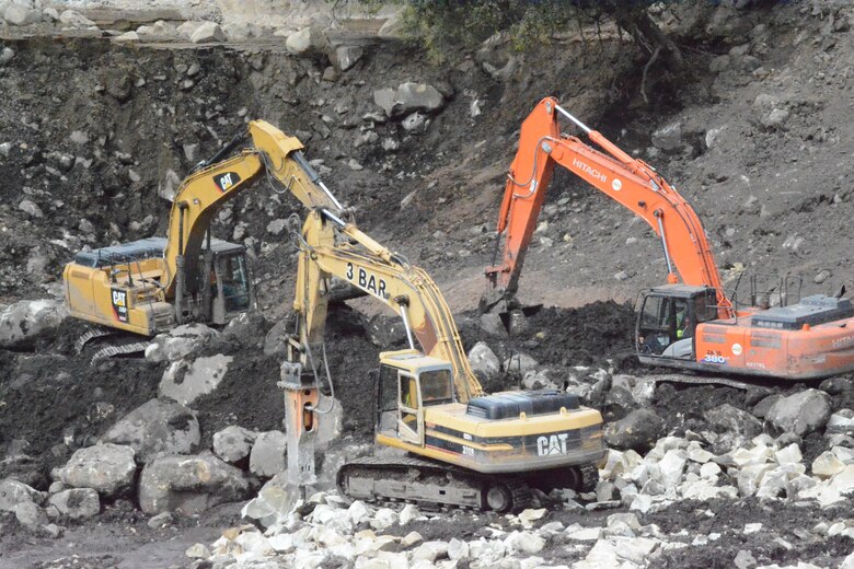 Contractors hired by the U.S. Army Corps of Engineers operate three bulldozers simultaneously to break up and remove large boulders out of the Santa Monica Basin Feb. 27 in Montecito, California. The basin was one of the largest and difficult ones to clear due to the magnitude of water, mud, debris and boulders that initially filled the basin.