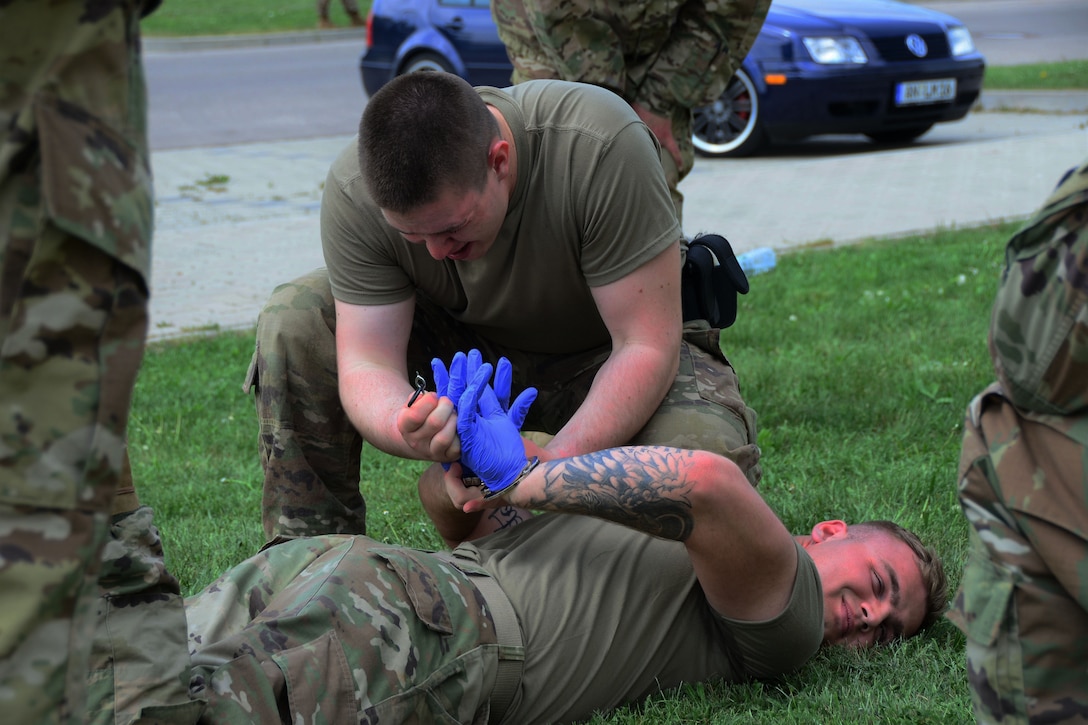 A soldier is restrained during certification training.