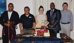 IMAGE: VIRGINIA BEACH, Va. (May 9, 2018) - Employees of Naval Surface Warfare Center Dahlgren Division (NSWCDD) Dam Neck Activity gave presentations on their heritage in Japan and the Philippines during the command's Asian American and Pacific Islander Heritage Month celebration. Pictured from left to right: Martial artist Jonathan Armstrong, Filipino-American presenter Pert Asiatico, and Japanese-American presenter Katherine Johnson with Marcus Matthews and Roberto Garcia of the NSWCDD Dam Neck Activity Diversity Committee. Johnson and Asiatico spoke on the rich cultural heritages of Japan and the Philippines, which they have experienced first-hand. Filipino food was enjoyed by many after the presentations.