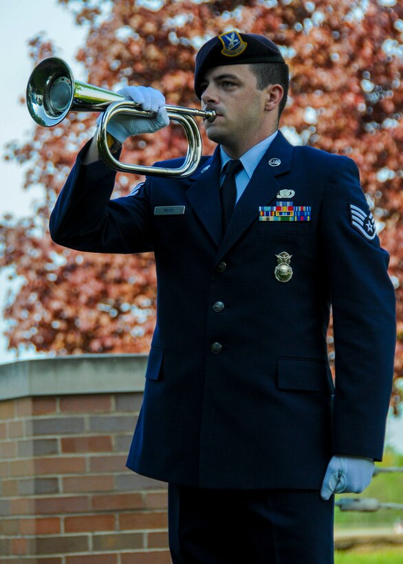 Staff Sgt. James L. Read, a fireteam member with the 910th Security Forces Squadron, plays “Taps” on a bugle during a ceremony in recognition of Peace Officers Memorial Day outside the 910th Airlift Wing Headquarters building here, May 16, 2018.