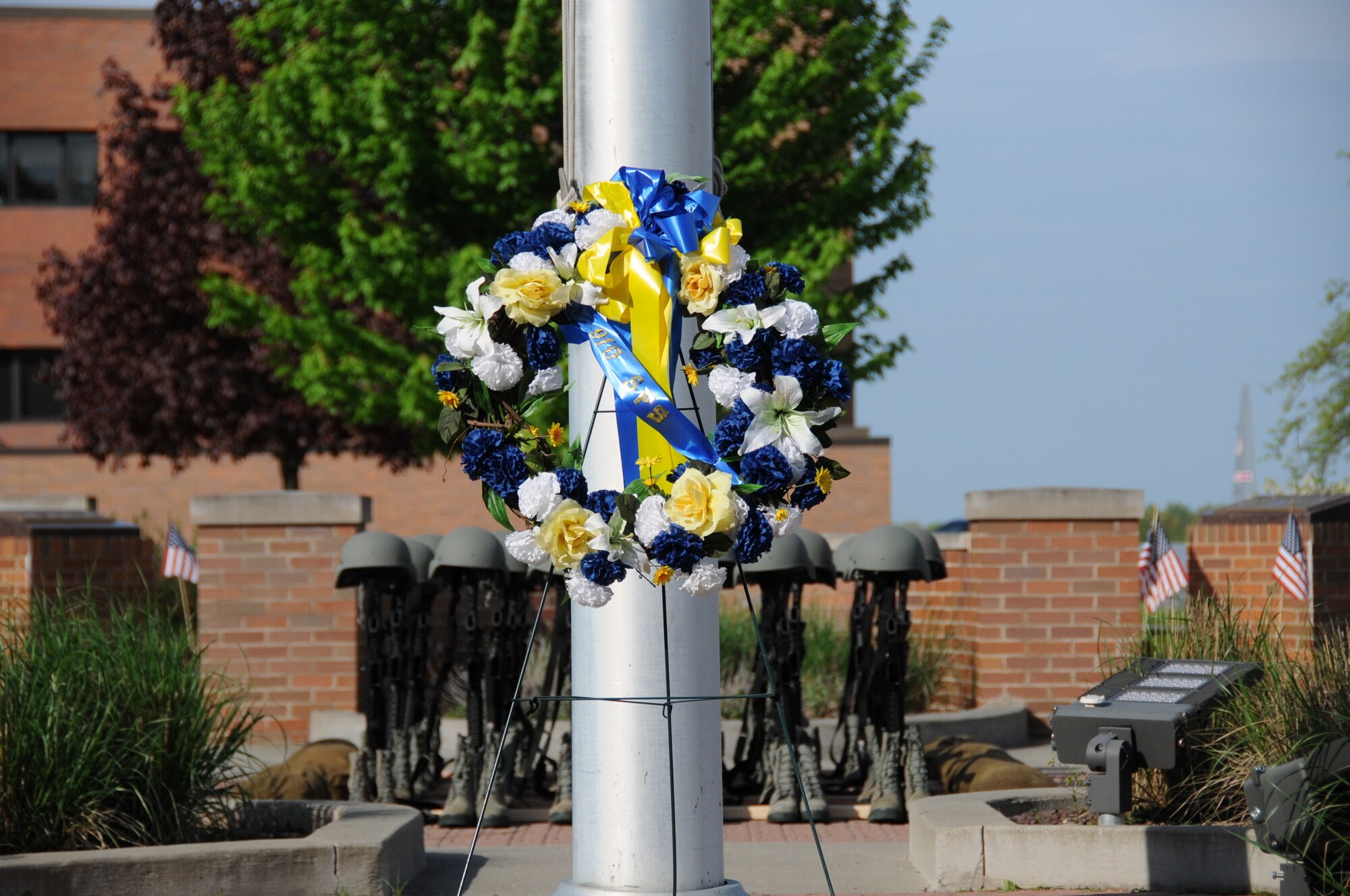 A memorial wreath rests in front of a formation of fallen soldier battle crosses after a ceremony in recognition of Peace Officers Memorial Day outside the 910th Airlift Wing Headquarters building on Youngstown Air Reserve Station, May 16, 2018.