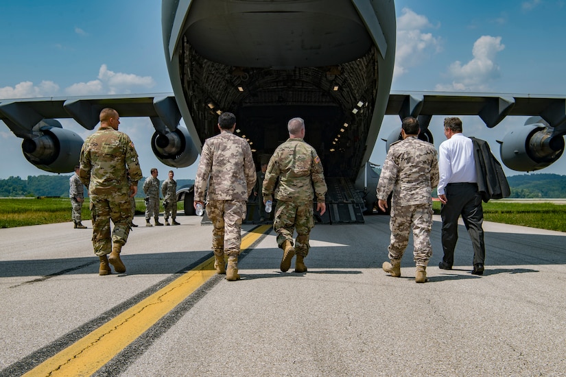 West Virginia National Guard and Qatar defense attaché leadership approach a C-17 Globemaster III from the 167th Airlift Wing as the two forces engage in meetings about the newly formed State Partnership Program May 14, 2018 at McLaughlin Air National Guard Base, Charleston, W.Va.