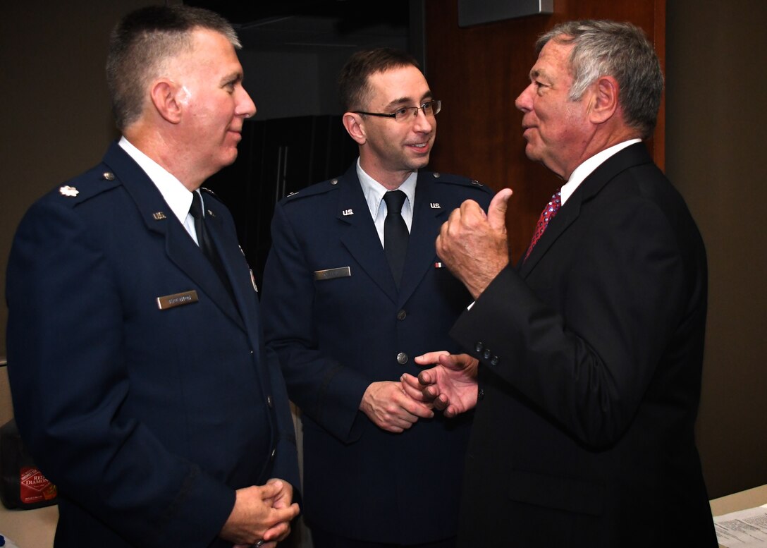 Chaplain (Lt. Col.) Ken Thornton and Chaplain (Maj.) Michael Williams listen to  United States Army retired, Brig. Gen.Charles Kruse talk about military connections.  Kruse was in town to perform the oath of office for newly-pinned Chaplain (Maj.) Michael Williams on May 6, 2018, at Scott Air Force Base, Ill.  Friends and family also came to witness the ceremony and wish Williams well.  Wing staff members helped put the event together and Chaplain (Capt.) Allen Haas gave the opening invocation.  (U.S. Air Force photo by Lt. Col. Stan Paregien)
